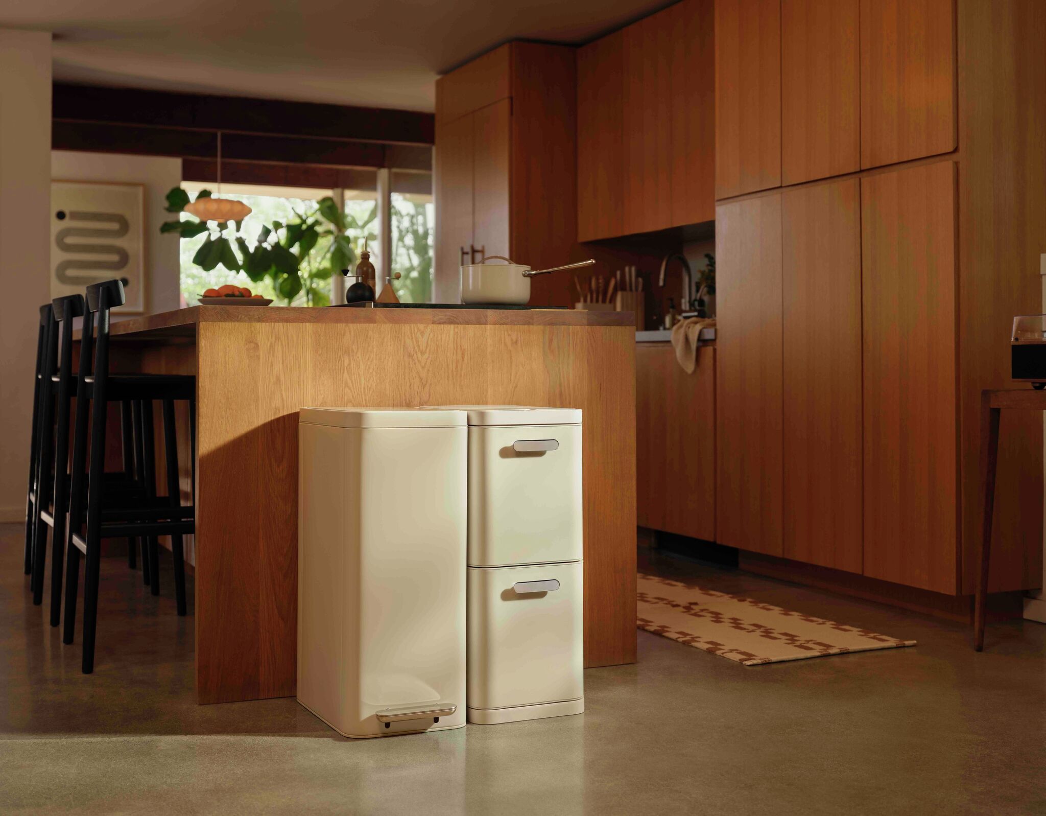 Caraway's new trash and recycling bins fix your ugly kitchen problem