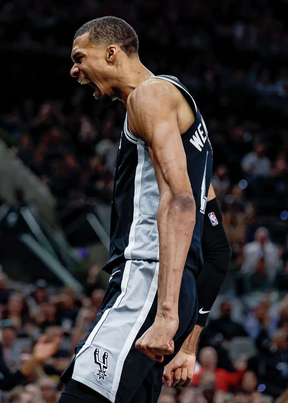 San Antonio Spurs forward Victor Wembanyama (1) reacts after dunking on the Philadelphia 76ers during the second quarter at Frost Bank Center in San Antonio, Monday, April 6, 2026.