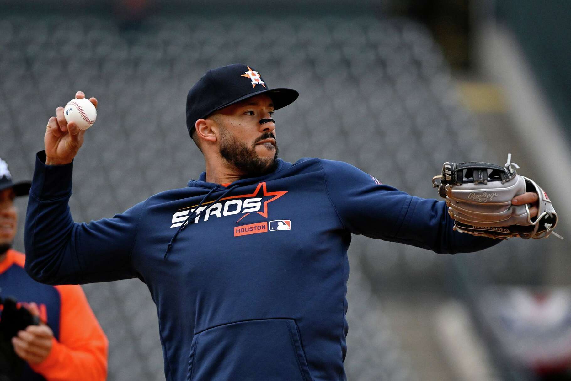 Houston Astros third baseman Carlos Correa throws prior to a baseball game against the Colorado Rockies, Monday, April 6, 2026, in Denver. (AP Photo/Geneva Heffernan)