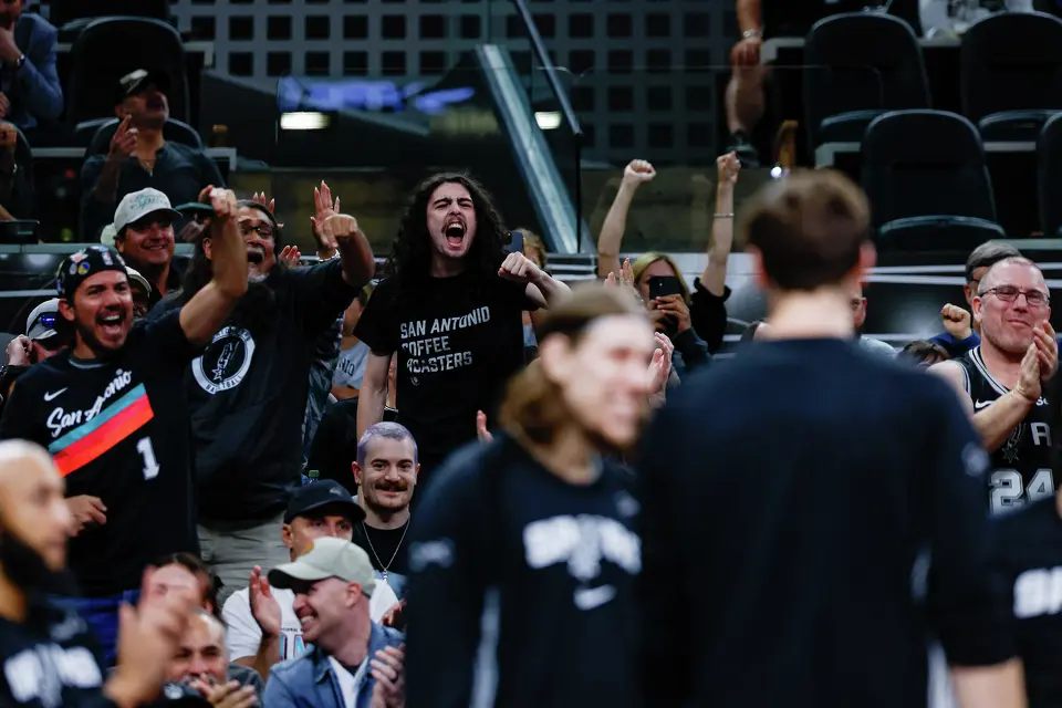 San Antonio Spurs fans cheer after watching San Antonio Spurs forward Victor Wembanyama (1) dunk on the Philadelphia 76ers during the second quarter at Frost Bank Center in San Antonio, Monday, April 6, 2026.