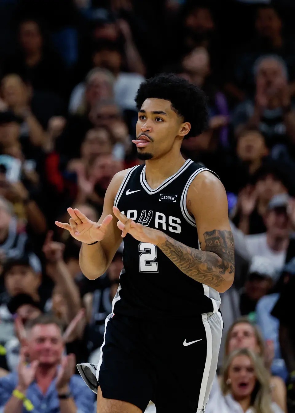 San Antonio Spurs guard Dylan Harper (2) reacts after making a 3-pointer against the Philadelphia 76ers during an NBA game at Frost Bank Center in San Antonio, Monday, April 6, 2026. The Spurs defeated the 76ers 115-102.