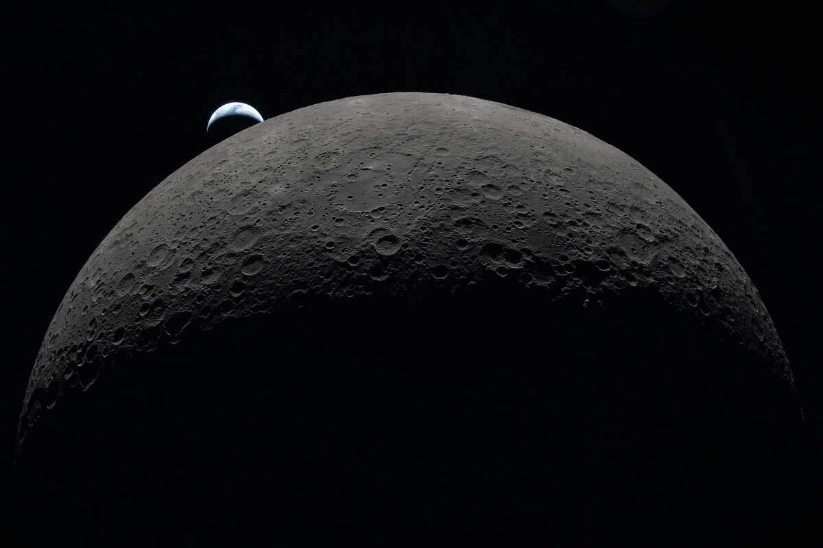 Earth sets at 6:41 p.m. EDT, April 6, 2026, over the Moon’s curved limb in this photo captured by the Artemis II crew during their journey around the far side of the Moon. Credit: NASA