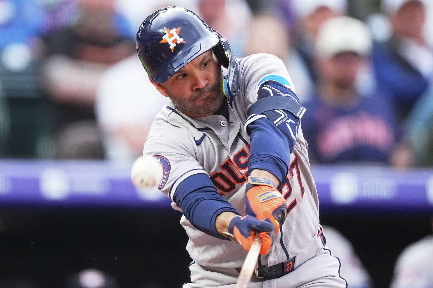 Houston Astros' Jose Altuve fouls off a pitch from Colorado Rockies starting pitcher Kyle Freeland in the first inning of a baseball game Tuesday, April 7, 2026, in Denver. (AP Photo/David Zalubowski)