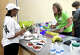 Community nutritionist Clanis Montes jokes with student Mikara Lloyd during the Good Eats Cooking Class at the Alice Keith Park Community Center. Photo made Thursday, April 2, 2026 Kim Brent/Beaumont Enterprise staff