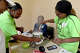 From left, Mikara Lloyd, Kimberly Kimbrough, April Gallien and Shakira Davis joke with one another as they prepare a healthy morning oatmeal during the Good Eats Cooking Class at Alice Keith Park community center. Photo made Thursday, April 2, 2026 Kim Brent/Beaumont Enterprise staff