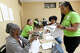 From left, Sylvia Johnson and Gina and Miriam Garcia talk with community coordinator Monica Mishaw as she distributes recipe instructions during the Good Eats Cooking Class at the Alice Keith Park Community Center. Photo made Thursday, April 2, 2026 Kim Brent/Beaumont Enterprise staff