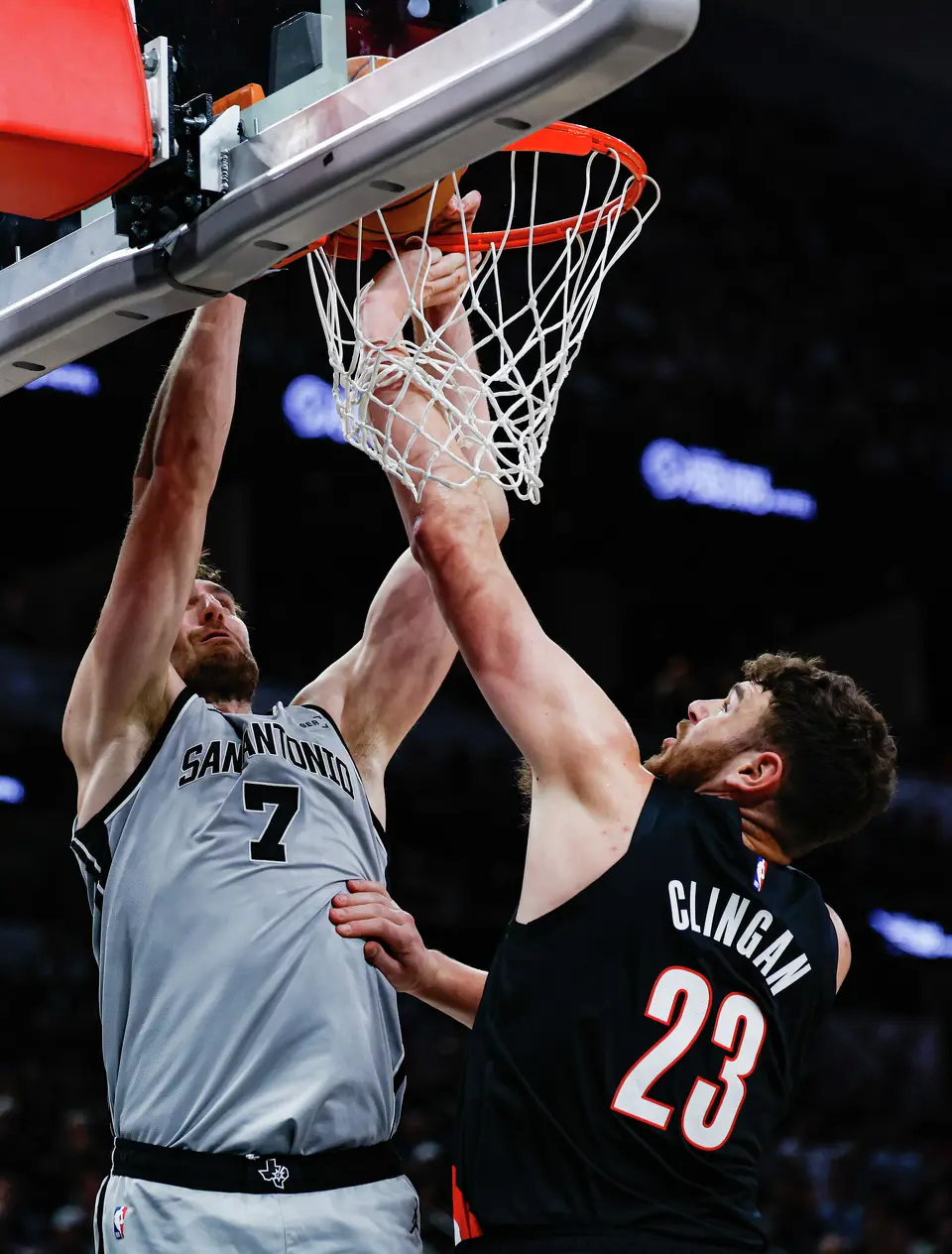 San Antonio Spurs center Luke Kornet (7) dunks over Portland Trail Blazers center Donovan Clingan (23) during the first quarter at Frost Bank Center in San Antonio, Wednesday, April 8, 2026.