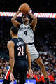 San Antonio Spurs guard De'aaron Fox (4) makes a jump shot over Portland Trail Blazers forward Kris Murray (24) during the second quarter at Frost Bank Center in San Antonio, Wednesday, April 8, 2026.