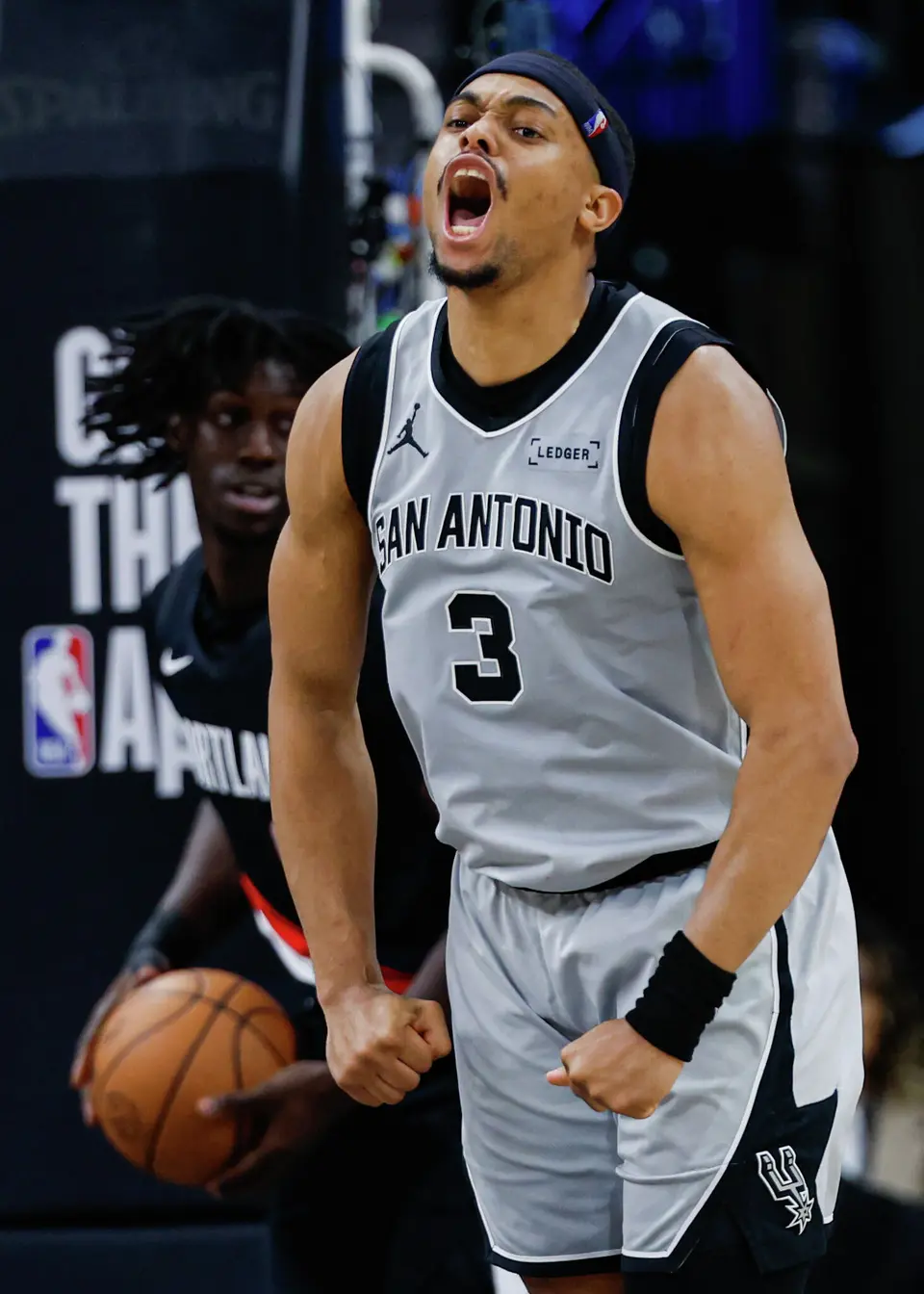 San Antonio Spurs forward Keldon Johnson (3) reacts after driving to the net for a basket against the Portland Trail Blazers at Frost Bank Center in San Antonio, Wednesday, April 8, 2026. The Spurs defeated the Trail Blazers 112-101.
