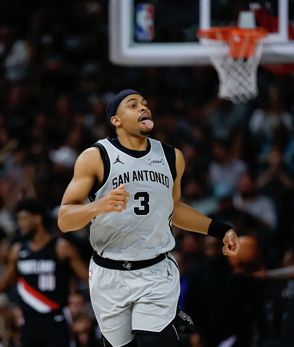 San Antonio Spurs forward Keldon Johnson (3) reacts to the cheering crowd after driving to the net for a basket against the Portland Trail Blazers at Frost Bank Center in San Antonio, Wednesday, April 8, 2026. The Spurs defeated the Trail Blazers 112-101.
