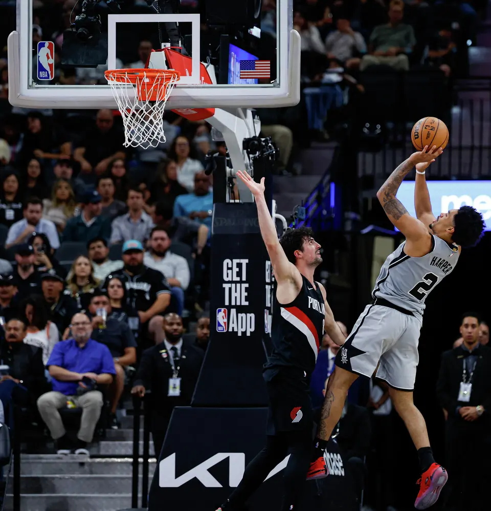 San Antonio Spurs guard Dylan Harper (2) shoots over Portland Trail Blazers forward Deni Avdija (8) during an NBA game at Frost Bank Center in San Antonio, Wednesday, April 8, 2026. The Spurs defeated the Trail Blazers 112-101.