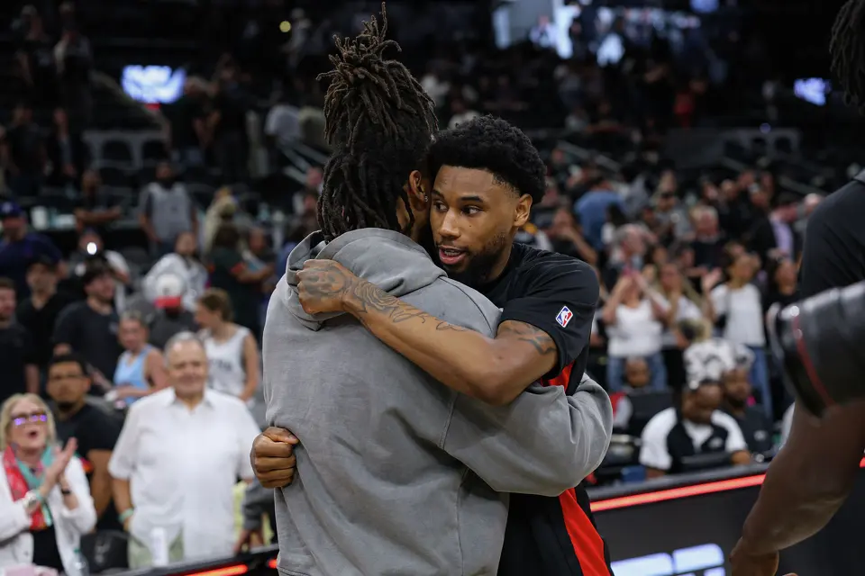 Former teammates San Antonio Spurs guard Stephon Castle (5) and Portland Trail Blazers guard Blake Wesley (1) embrace following their game at Frost Bank Center in San Antonio, Wednesday, April 8, 2026. The Spurs defeated the Trail Blazers 112-101.
