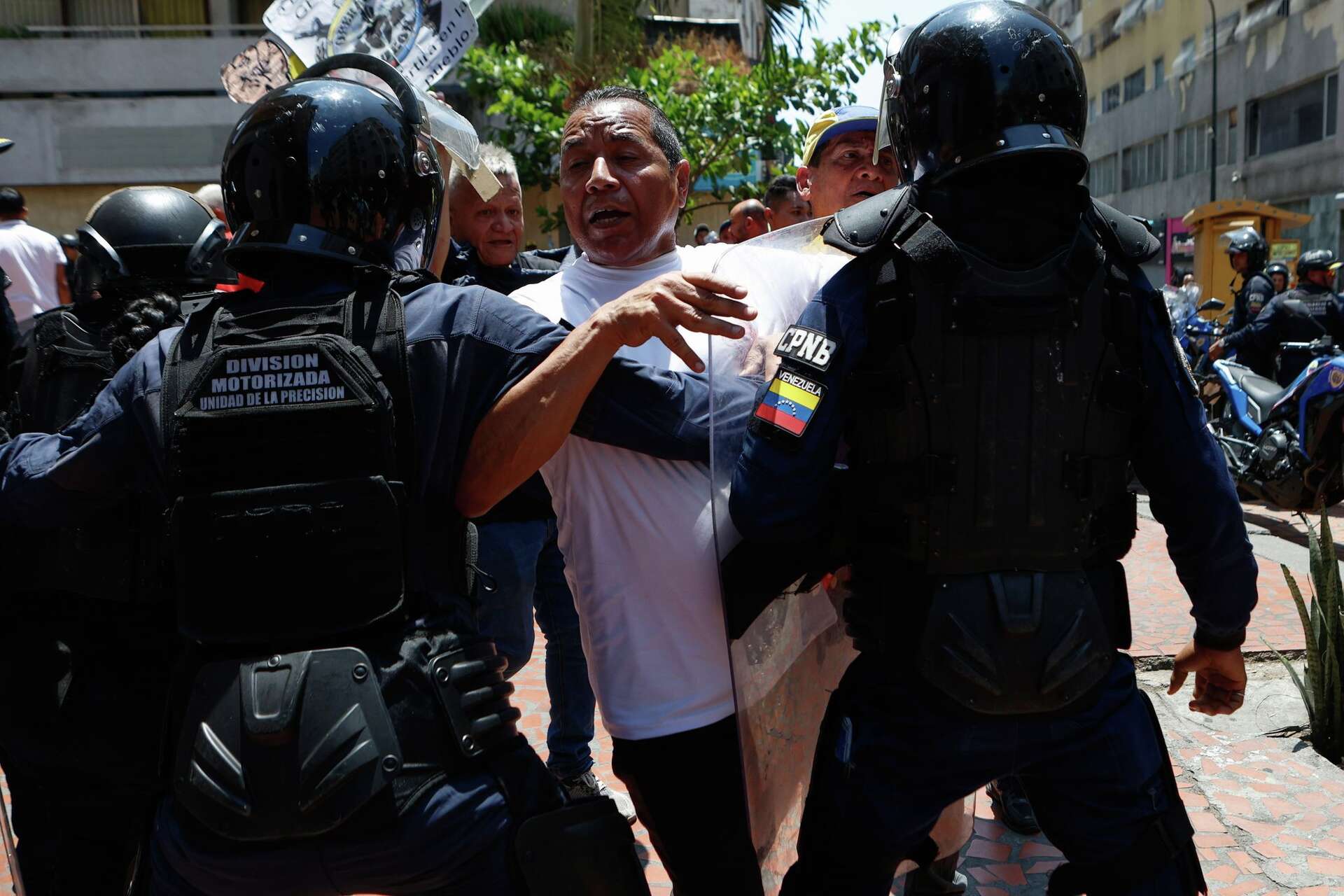 Venezuelan police block protesters demanding higher wages and pensions