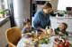 Cooking healthy meals together is a good way to develop healthy eating habits, experts say.