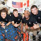 The Artemis II crew – from left, NASA astronaut Christina Hammock Koch, Canadian Space Agency astronaut Jeremy Hansen, NASA astronaut Victor Glover and NASA astronaut Reid Wiseman – pause for a group photo on April 7, 2026, inside the Orion spacecraft on their way home. Credit: NASA