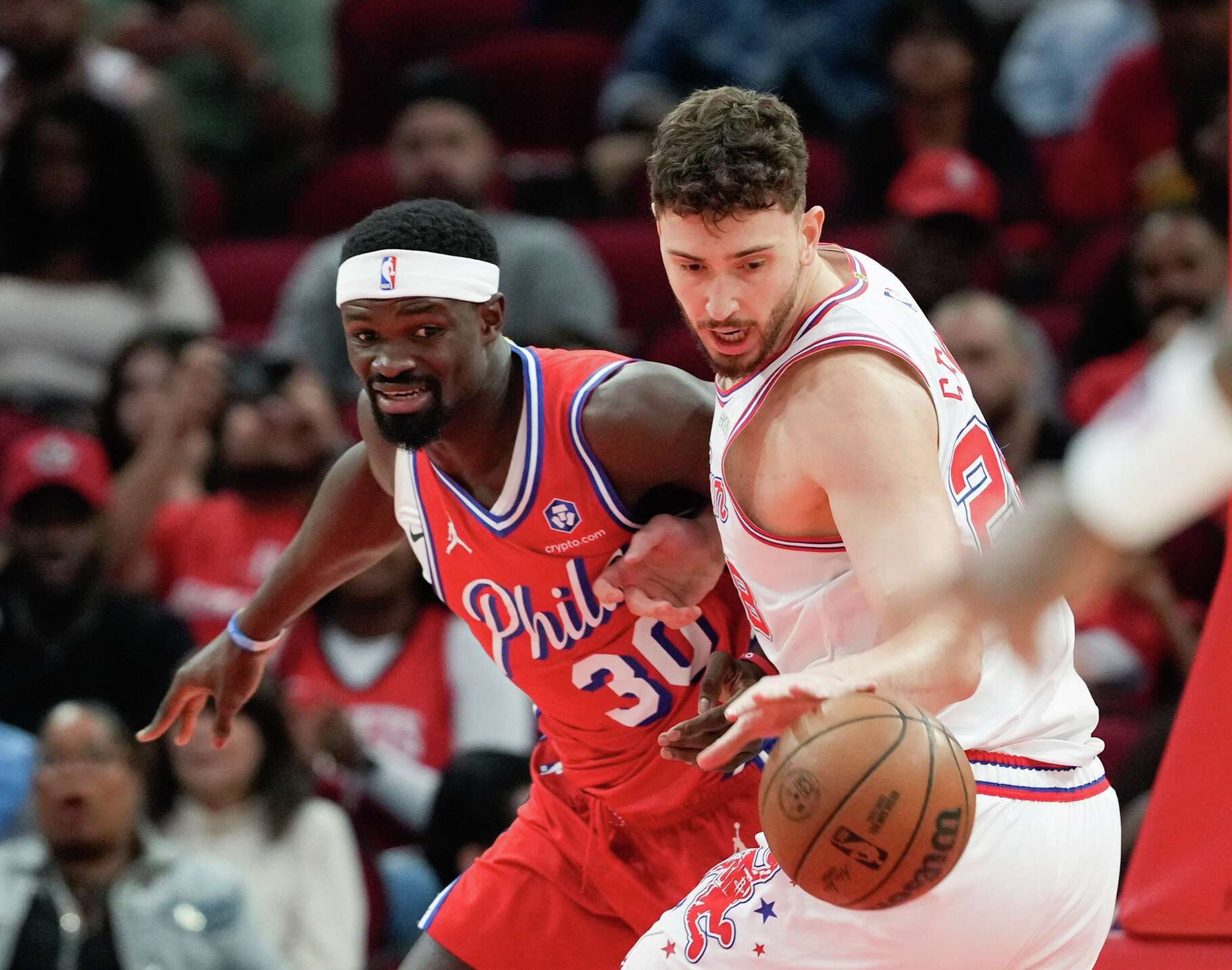 Houston Rockets center Alperen Sengun (28) steals the ball from Philadelphia 76ers center Adem Bona (30) at the Toyota Center in Houston on Thursday, April 9, 2026.