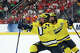 T.J. Hughes #13 and Adam Valentini of the Michigan Wolverines celebrate after a goal against the Denver Pioneers during the Division I Men's Ice Hockey Championship held at T-Mobile Arena on April 9, 2026 in Las Vegas, Nevada.
