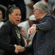 South Carolina head coach Dawn Staley, center, and UConn head coach Geno Auriemma argue after a woman's NCAA college basketball tournament semifinal game at the Final Four, Friday, April 3, 2026, in Phoenix, Ariz.
