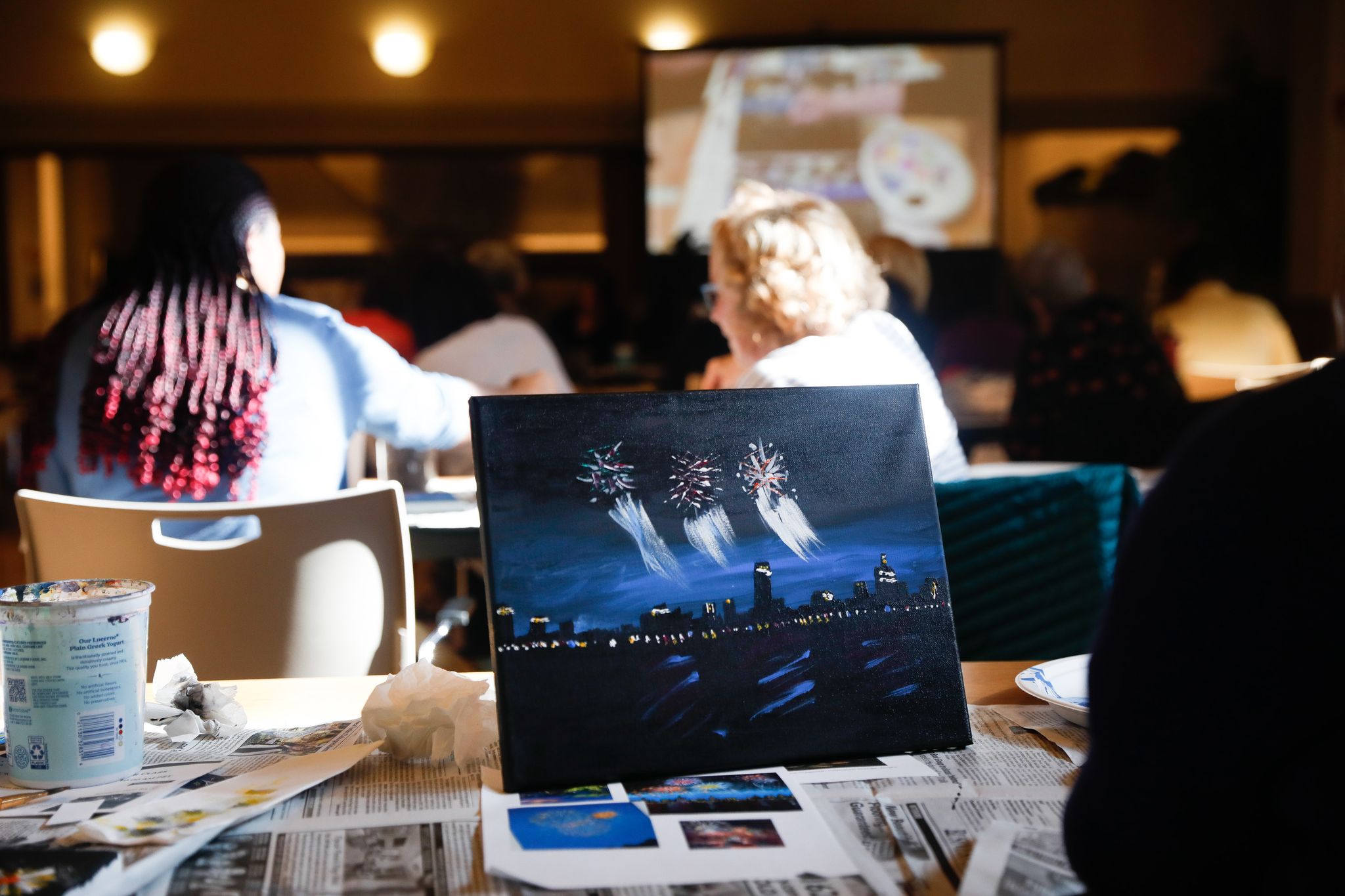 Older adults participating in an art class at a retirement community