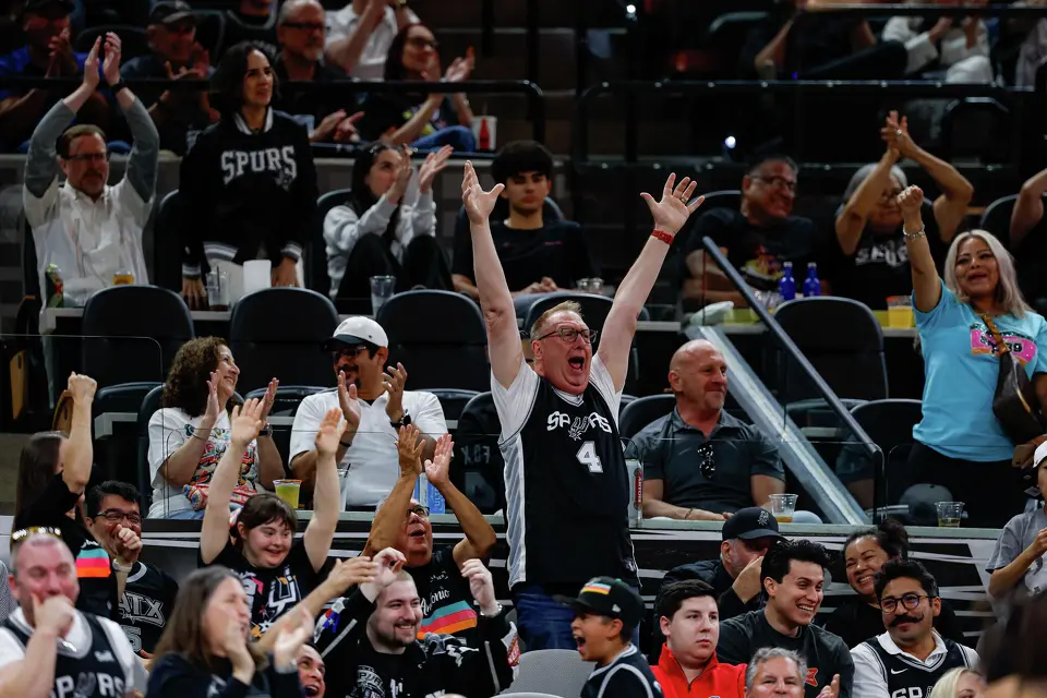San Antonio Spurs fans cheer after watching Spurs’ forward Victor Wembanyama dunk on the Dallas Mavericks during the first quarter at Frost Bank Center in San Antonio, Friday, April 10, 2026. The Spurs won 139-120.