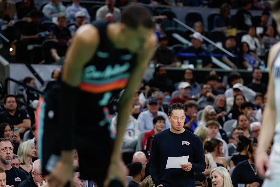 San Antonio Spurs head coach Mitch Johnson watches his team take on the Dallas Mavericks at Frost Bank Center in San Antonio, Friday, April 10, 2026. The Spurs won 139-120.