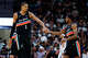 San Antonio Spurs forward Victor Wembanyama (1) and guard De'aaron Fox (4) slap hands during the fourth quarter against the Dallas Mavericks at Frost Bank Center in San Antonio, Friday, April 10, 2026. The Spurs won 139-120.