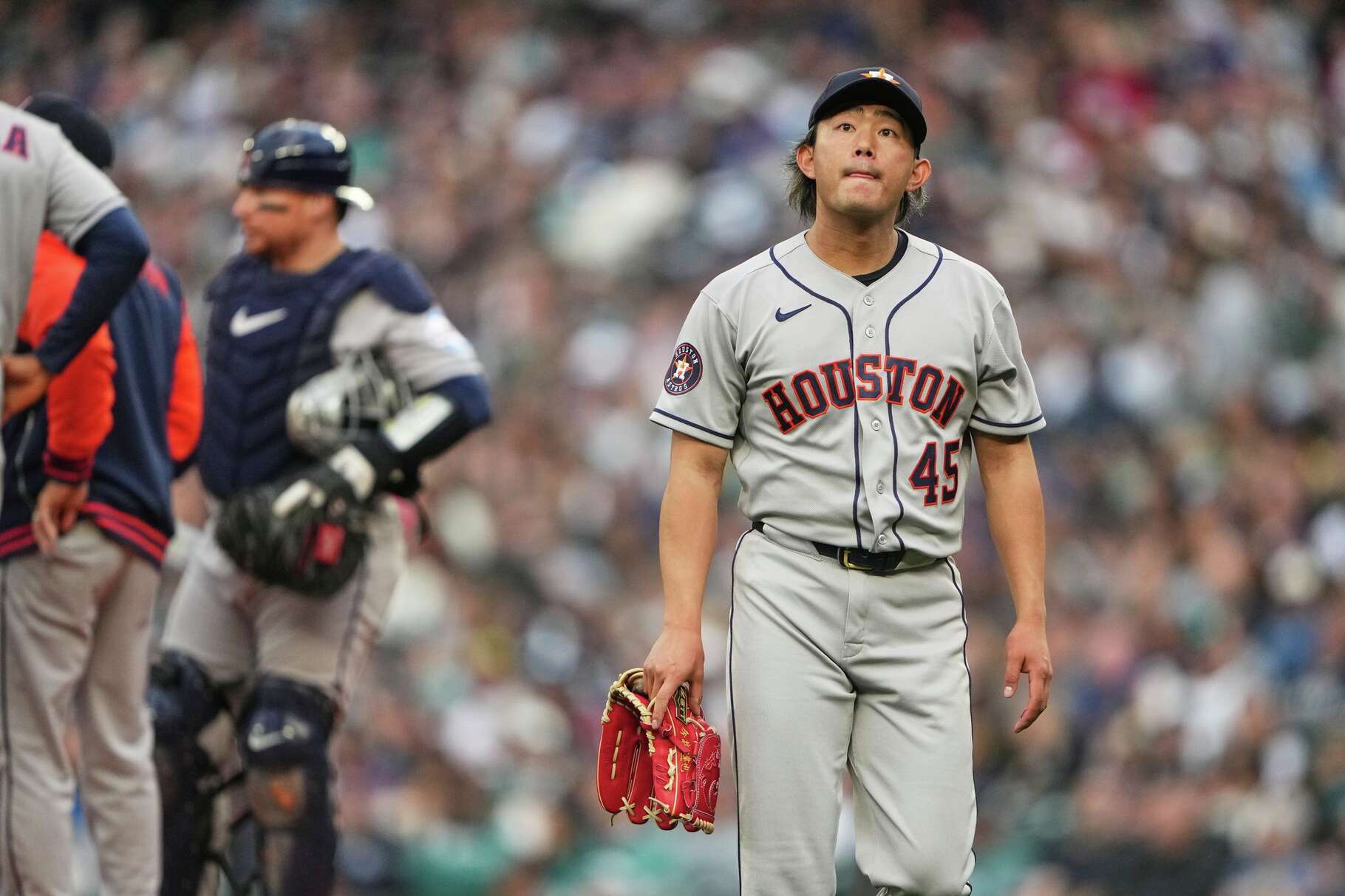 Houston Astros starting pitcher Tatsuya Imai walks back to the dugout after being taken out of the game during the first inning of a baseball game against the Seattle Mariners, Friday, April 10, 2026, in Seattle. (AP Photo/Lindsey Wasson)