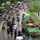 People take in art cars lining Dallas Street during the annual Art Car Parade in downtown Houston, Saturday, April 11, 2026.