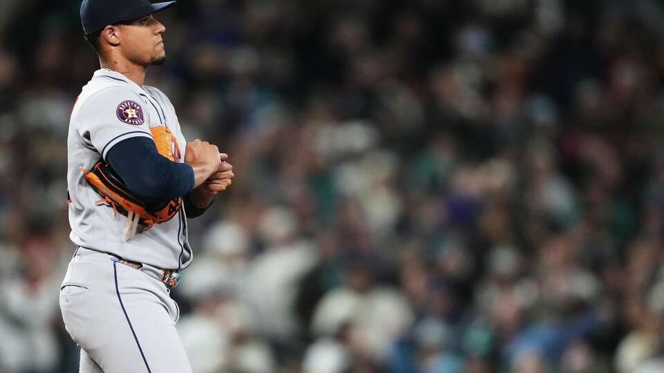 Houston Astros relief pitcher Bryan Abreu walks on the mound during the ninth inning of a baseball game against the Seattle Mariners, Saturday, April 11, 2026, in Seattle. (AP Photo/Lindsey Wasson)