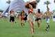 FILE - Festivalgoers run toward the main stage at the Coachella Valley Music and Arts Festival in Indio, Calif., on April 13, 2012.