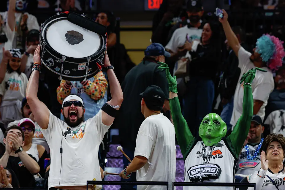 Members of the Jackals cheer after leading a group clap before the start of the last regular home game of the season against the Denver Nuggets at Frost Bank Center in San Antonio, Sunday, April 12, 2026.