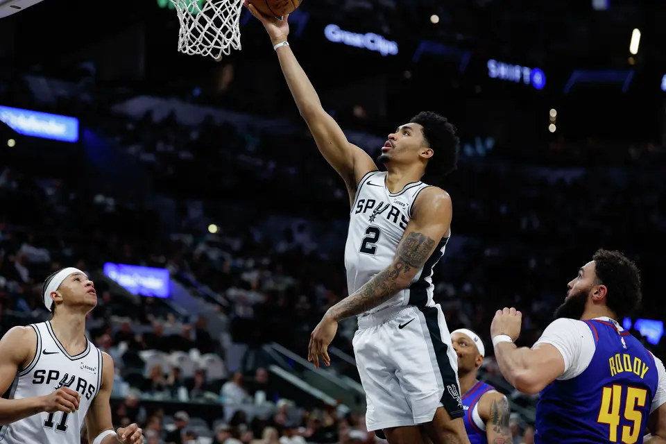 San Antonio Spurs guard Dylan Harper (2) goes up for a shot during the third quarter against the Denver Nuggets at Frost Bank Center in San Antonio, Sunday, April 12, 2026. The Spurs lost 128-118 to the Nuggets in their final regular-season game.