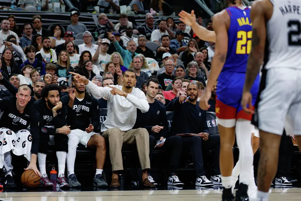 San Antonio Spurs forward Victor Wembanyama (1) signals from the bench while watching his teammates take on the Denver Nuggets at Frost Bank Center in San Antonio, Sunday, April 12, 2026. The Spurs lost 128-118 to the Nuggets in their final regular-season game.