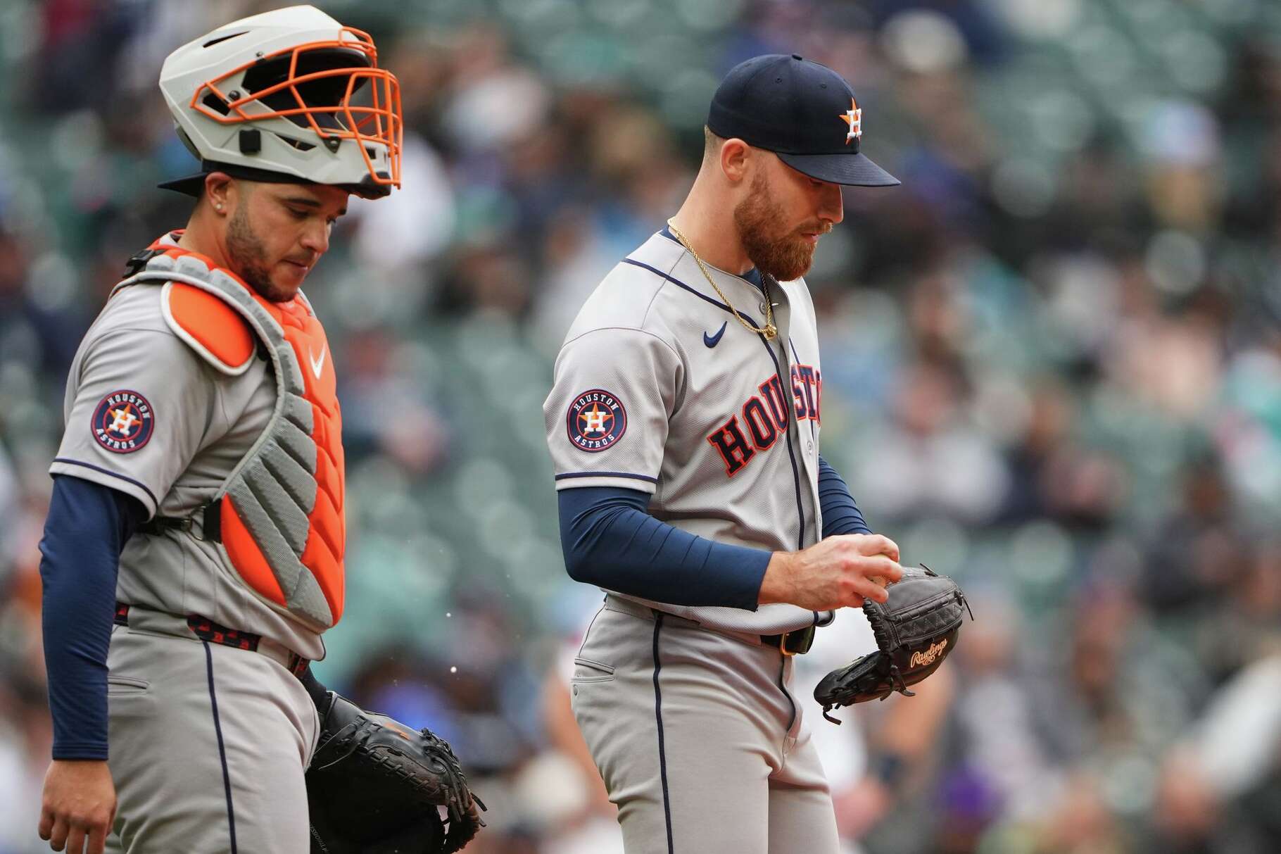 Houston Astros catcher Yainer Diaz comes to the mound to talk to starting pitcher Mike Burrows during the fifth inning of a baseball game against the Seattle Mariners, Monday, April 13, 2026, in Seattle. (AP Photo/Lindsey Wasson)