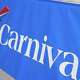 FILE - A Carnival Cruise Line sign is displayed Jan. 29, 2021, at PortMiami in Miami.