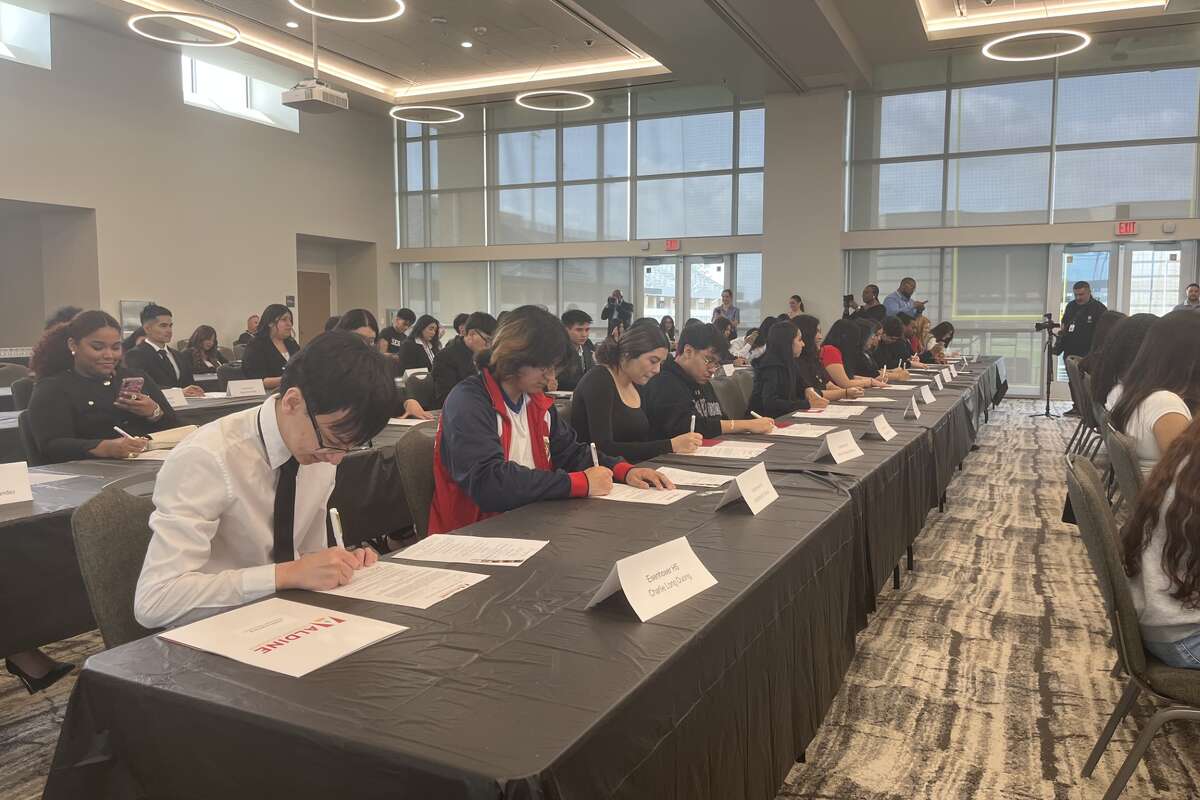 Aldine ISD students sign letters of intent to return to the district and work there after completing certifications or getting a degree.