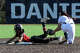 Avery Radford of Cheshire steals second with Emily Speringo of Foran covering in Milford on April 17, 2026.