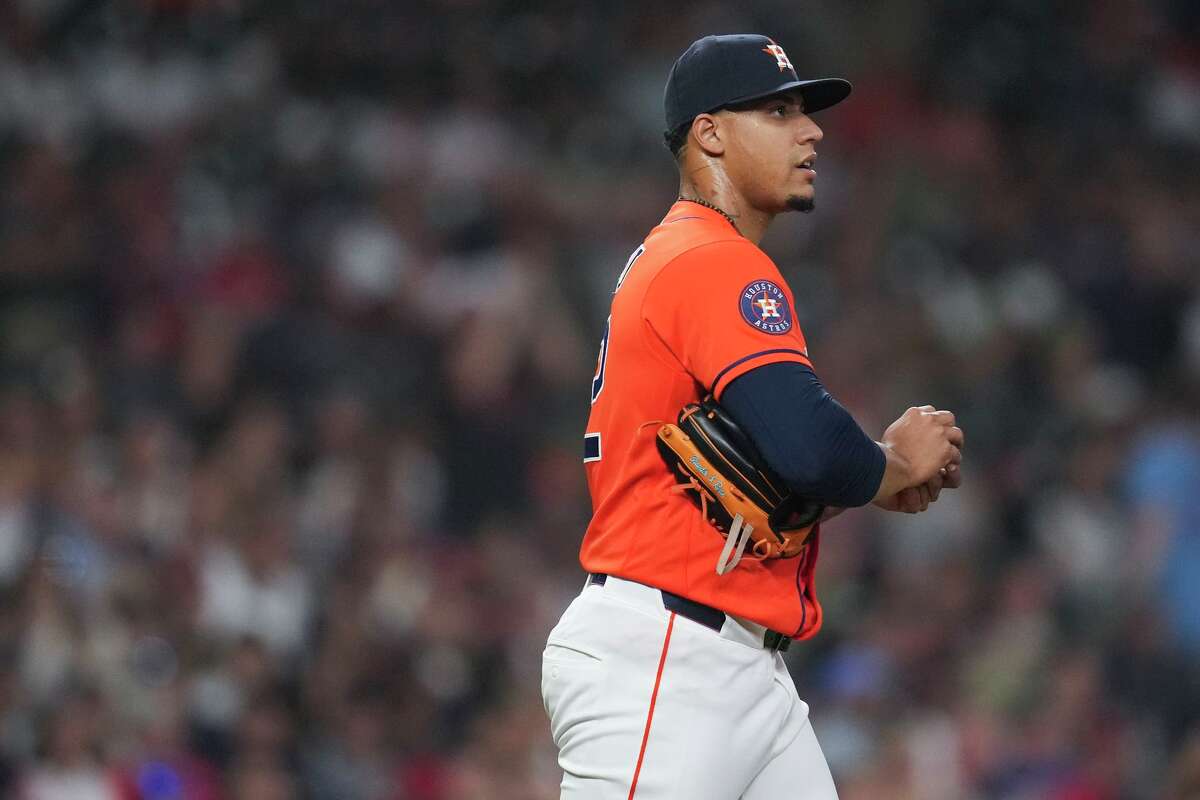 Houston Astros relief pitcher Bryan Abreu (52) reacts after giving up a 3-run home tun to St. Louis Cardinals Nolan Gorman during the seventh inning of an MLB baseball game at Daikin Park, Friday, April 17, 2026, in Houston.