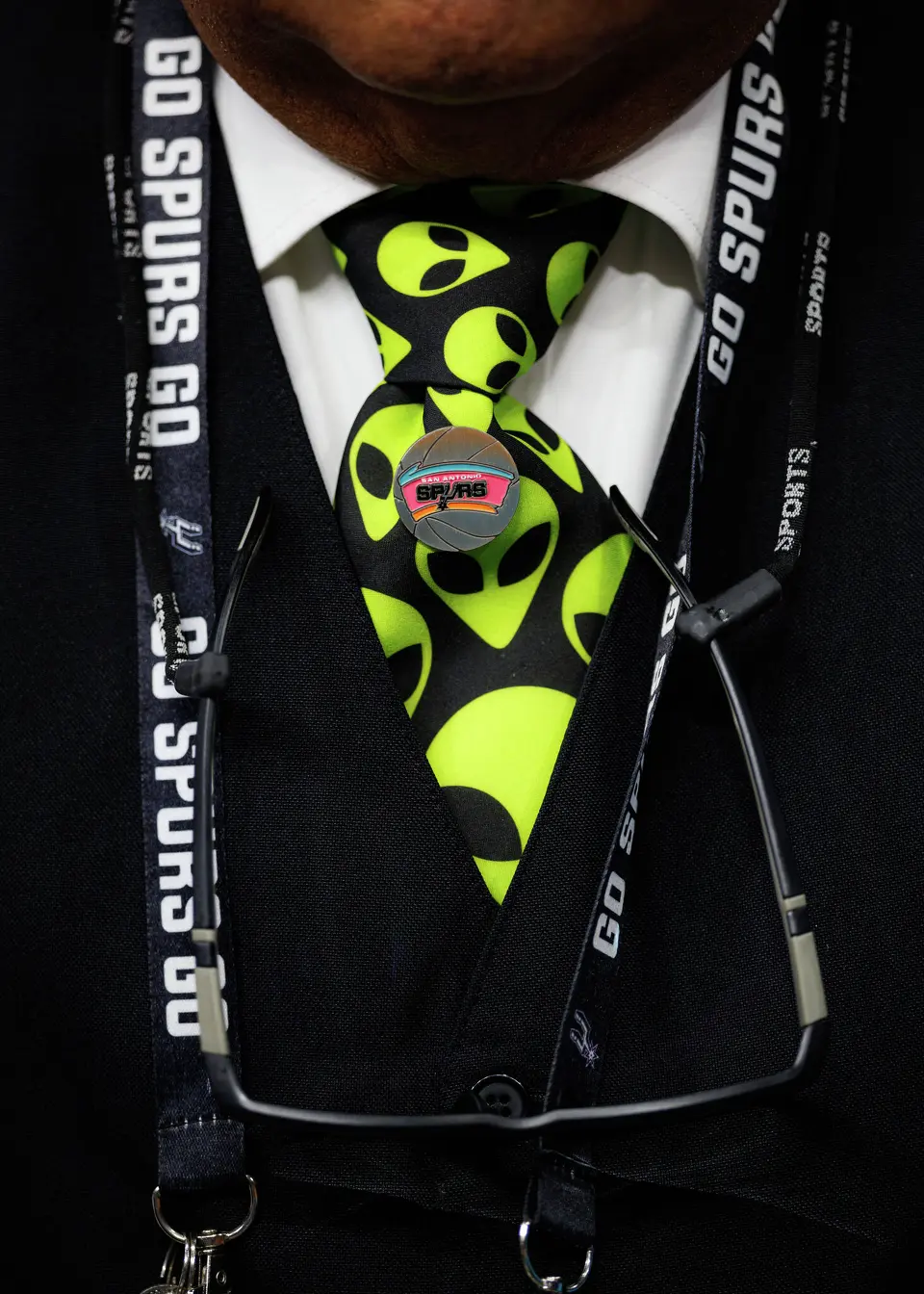 Freddie Ordones, a Frost Bank Center employee, sports an alien tie in honor of Victor Wembanyama during Game 1 of a first-round NBA playoff series between the San Antonio Spurs and the Portland Trail Blazers at Frost Bank Center, Sunday, April 19, 2026, in San Antonio.