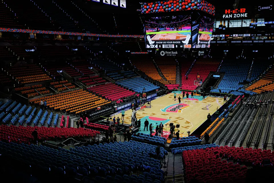The San Antonio Spurs and Portland Trail Blazers players warm up before the start of Game 1 of a first-round NBA playoff series at Frost Bank Center, Sunday, April 19, 2026, in San Antonio.