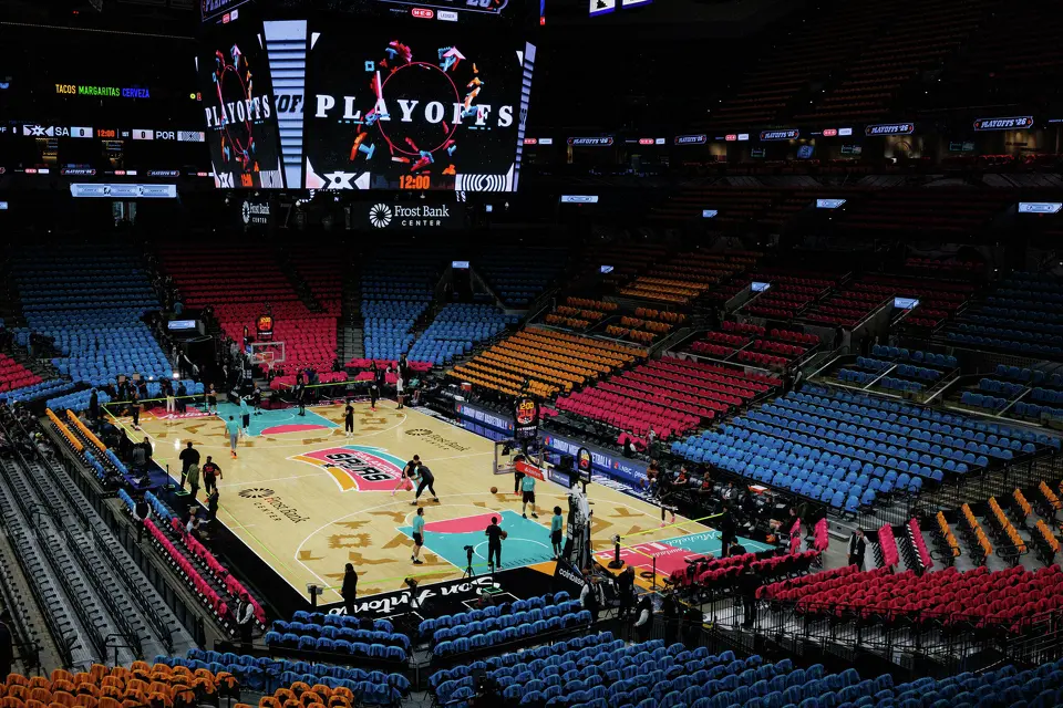 The San Antonio Spurs and Portland Trail Blazers players warm up on the court before the start of Game 1 of a first-round NBA playoff series at Frost Bank Center, Sunday, April 19, 2026, in San Antonio.