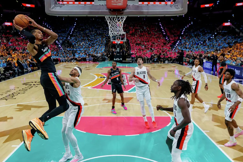 San Antonio Spurs forward Victor Wembanyama (1) goes up for a shot over Portland Trail Blazers forward Toumani Camara (33) during the second half of Game 1 of a first-round NBA playoff series at Frost Bank Center, Sunday, April 19, 2026, in San Antonio. The Spurs won 111-98.