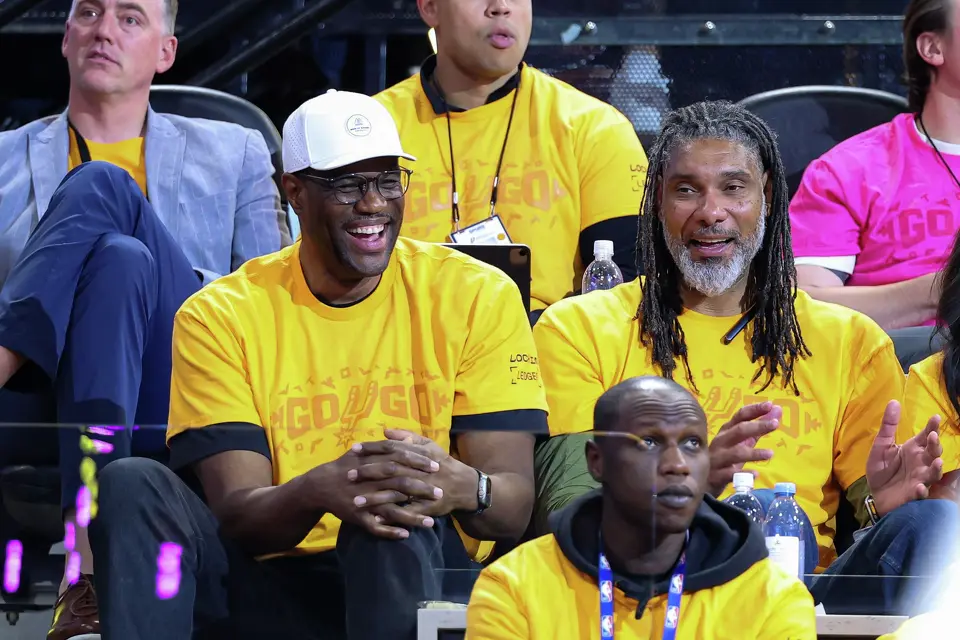 Former San Antonio Spurs players David Robinson, left, and Tim Duncan watch the fourth quarter of Game 1 of a first-round NBA playoff series between the Spurs and the Portland Trail Blazers at Frost Bank Center on Sunday, April 19, 2026, in San Antonio. The Spurs won 111-98.