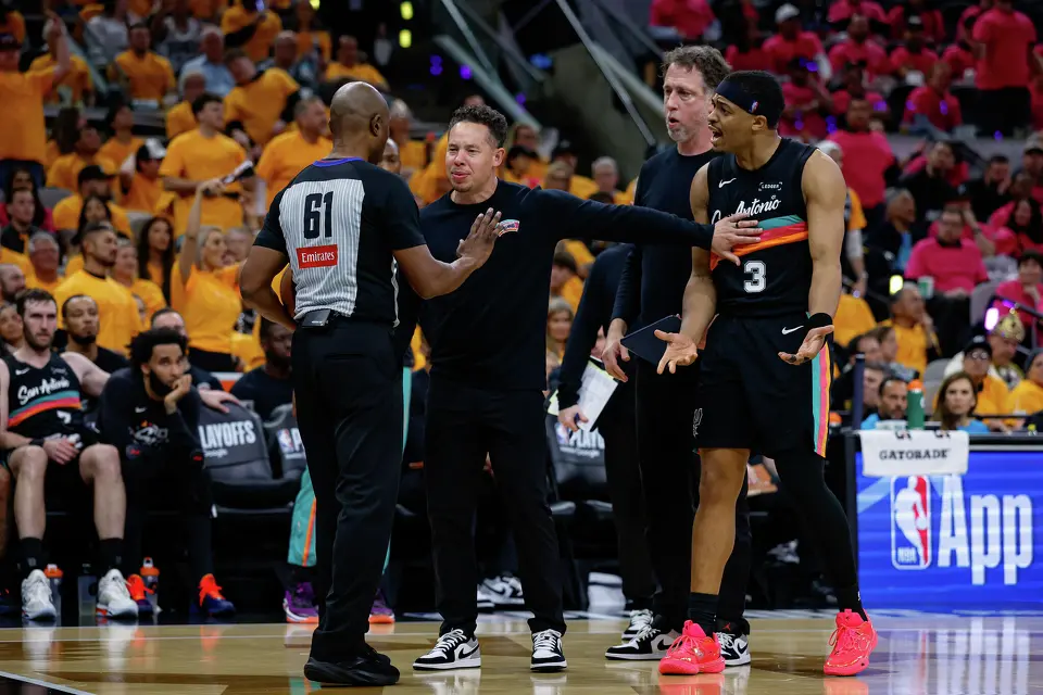 San Antonio Spurs head coach Mitch Johnson and San Antonio Spurs forward Keldon Johnson (3) react to a technical foul called on the Spurs during the second half of Game 1 of a first-round NBA playoff series against the Portland Trail Blazers at Frost Bank Center, Sunday, April 19, 2026, in San Antonio. The Spurs won 111-98.