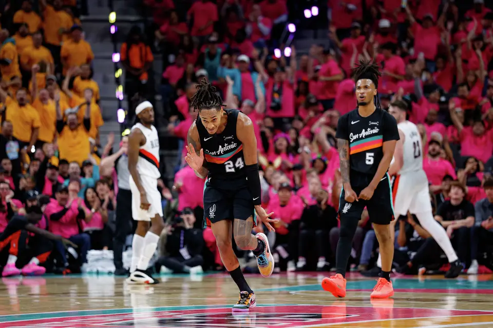 San Antonio Spurs guard Devin Vassell (24) celebrates a 3-pointer during the second half of Game 1 of a first-round NBA playoff series against the Portland Trail Blazers at Frost Bank Center, Sunday, April 19, 2026, in San Antonio. The Spurs won 111-98.