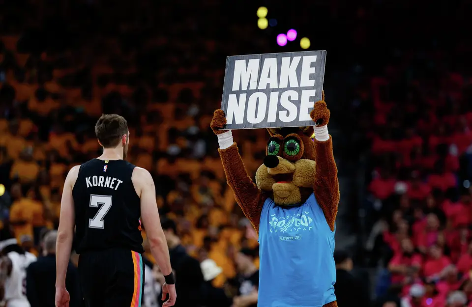 The Coyote prompts fans to get louder during the first half of Game 1 of a first-round NBA playoff series between the San Antonio Spurs and Portland Trail Blazers at Frost Bank Center, Sunday, April 19, 2026, in San Antonio.