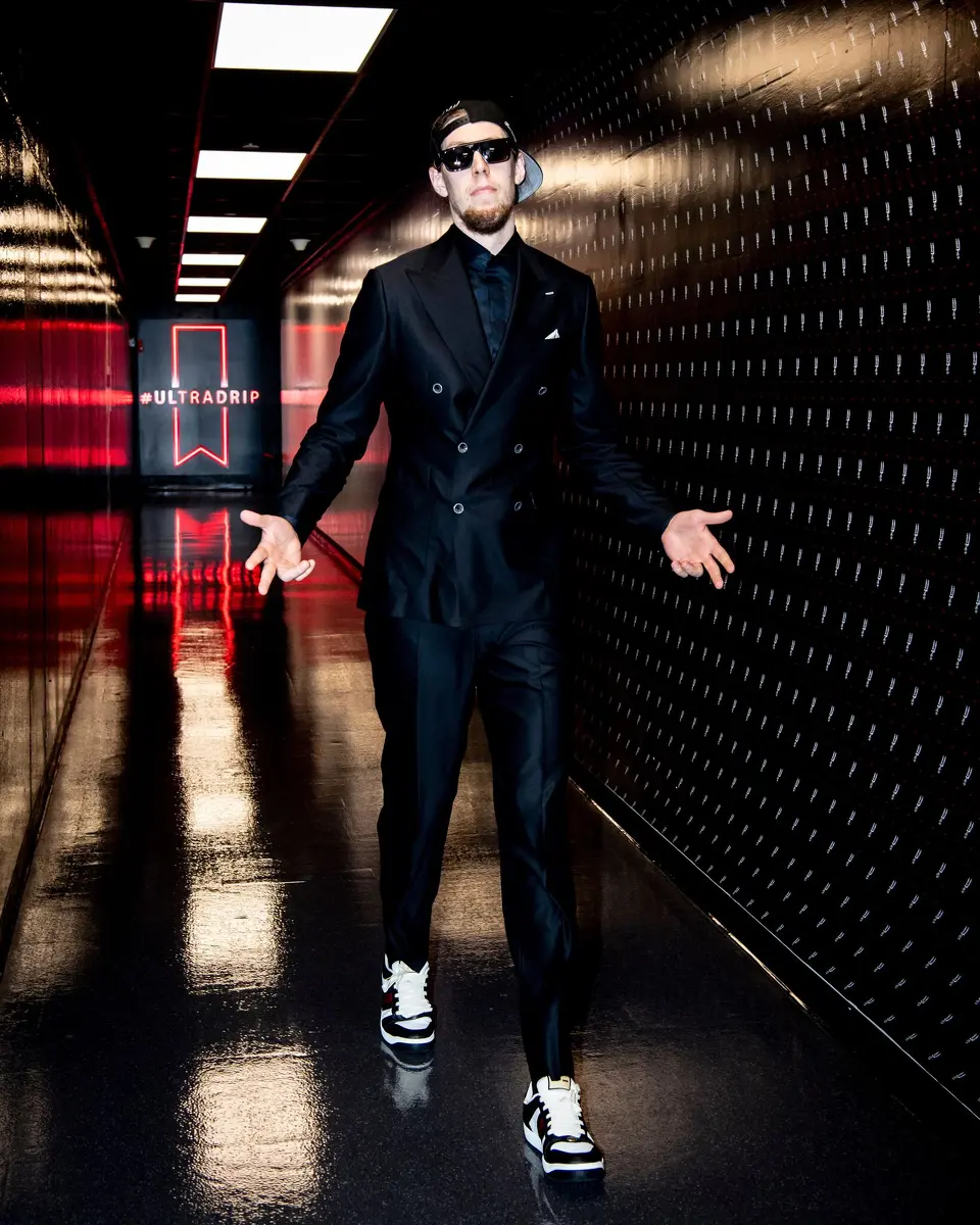 Forward/center Kelly Olynyk arrives at the Frost Bank Center for Game 1 of the Spurs' playoff series with Portland on Sunday, April 19, 2026 dressed in a custom-made black suit made by his friend, Miami-based tailor Jay Amin.
