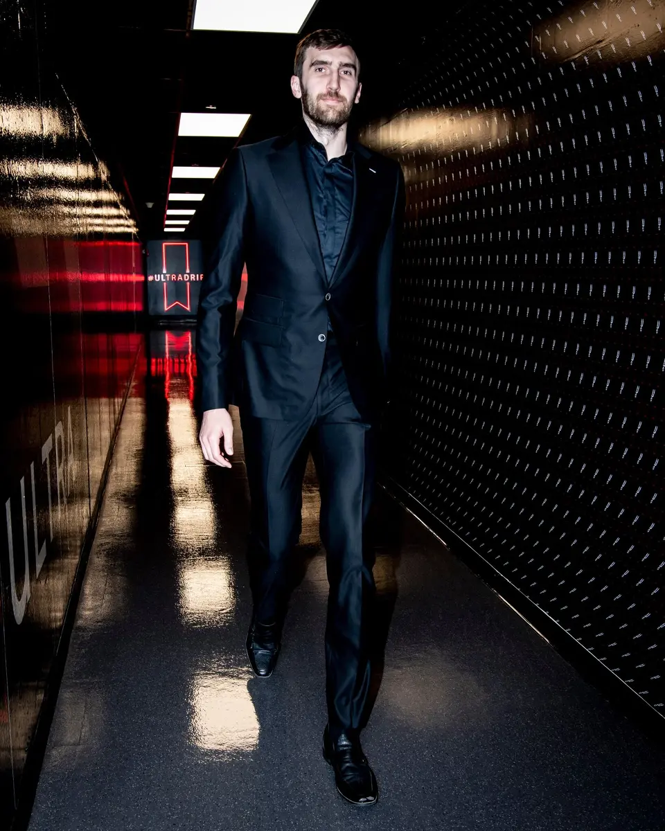 Center Luke Kornet arrives at the Frost Bank Center for Game 1 of the Spurs' playoff series with Portland on Sunday, April 19, 2026 dressed in a custom-made black suit bought by teammate Kelly Olynyk.