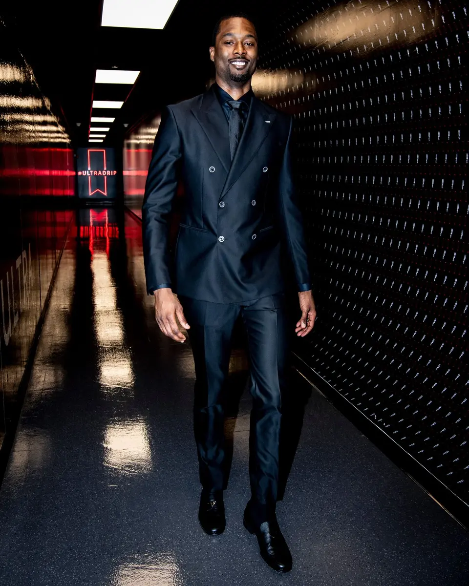 Forward Harrison Barnes arrives at the Frost Bank Center for Game 1 of the Spurs' playoff series with Portland on Sunday, April 19, 2026 dressed in a custom-made black suit bought by teammate Kelly Olynyk.