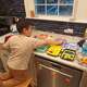 Rebecca Kaplan, a primary care provider with Hartford HealthCare, encourages her children to help out in the kitchen. Here, Noah Kaplan helps prepare lunches and snacks.